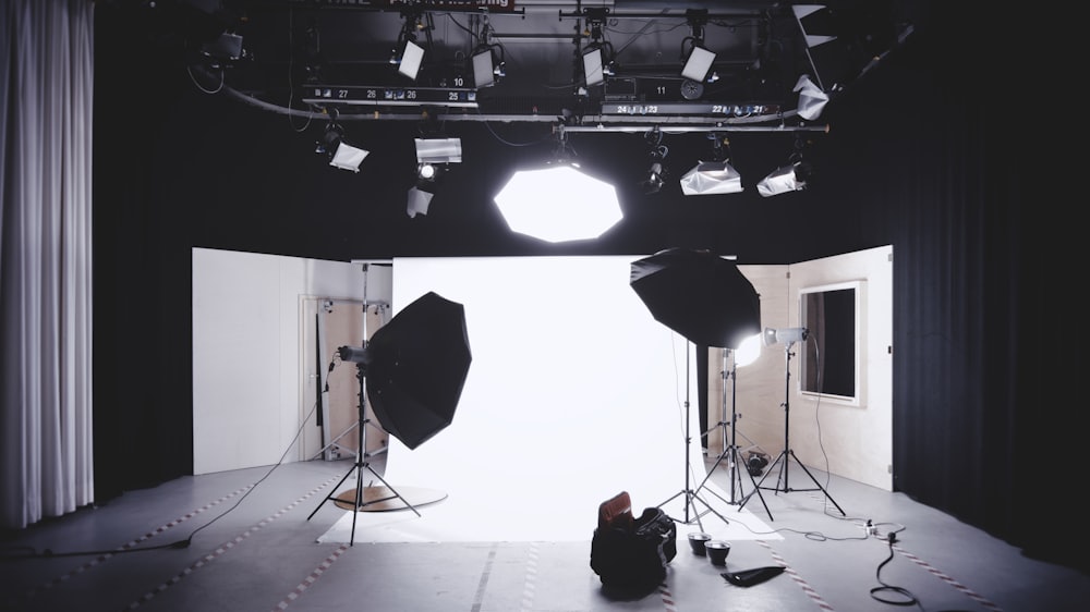 A photography studio lit with softboxes, backdrop and stands set up