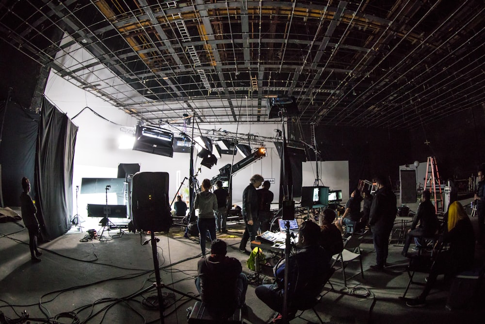 A film crew at work on a lit sound stage