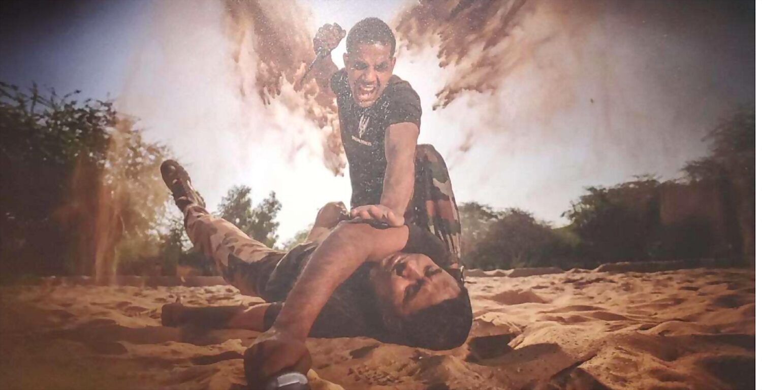 A soldier dragging a casualty clear of a detonation