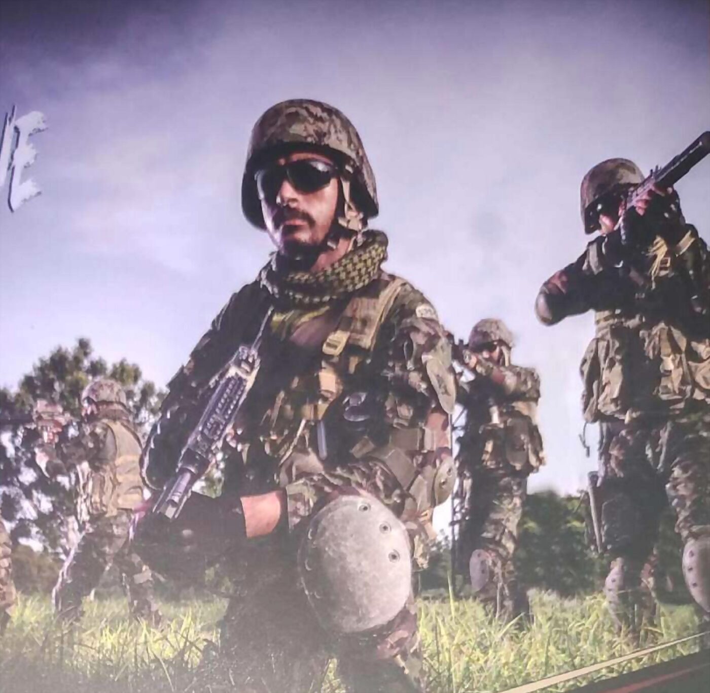 Paratroopers advancing in line across open ground